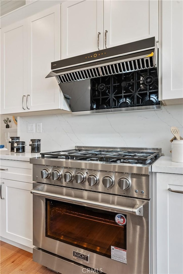 18762 Pimlico, Yorba Linda, CA 92886 - kitchen view of stainless steel stove, white cabinets, backsplash, and light countertops