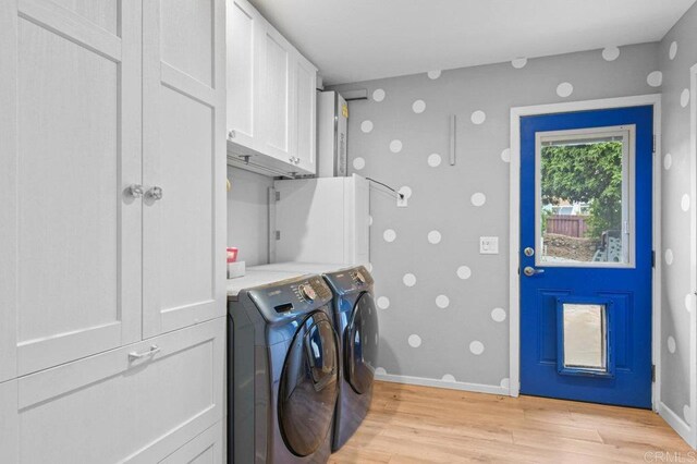 5441 Pennsylvania Ln, La Mesa, CA 91942 - washroom with light wood-style flooring, separate washer and dryer, cabinet space, and baseboards
