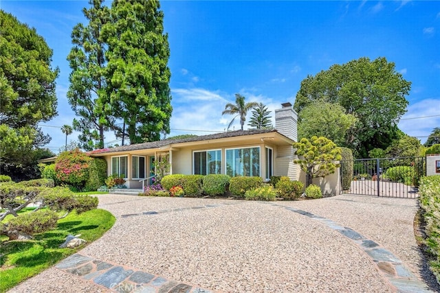 2208 Thorley Pl, Palos Verdes Estates, CA 90274 - back of property with a gate, driveway, and a chimney