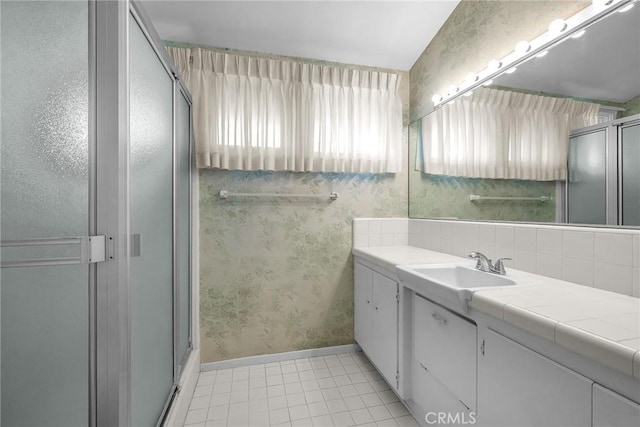 2208 Thorley Pl, Palos Verdes Estates, CA 90274 - bathroom with vanity, wallpapered walls, a shower stall, tile patterned floors, and baseboards