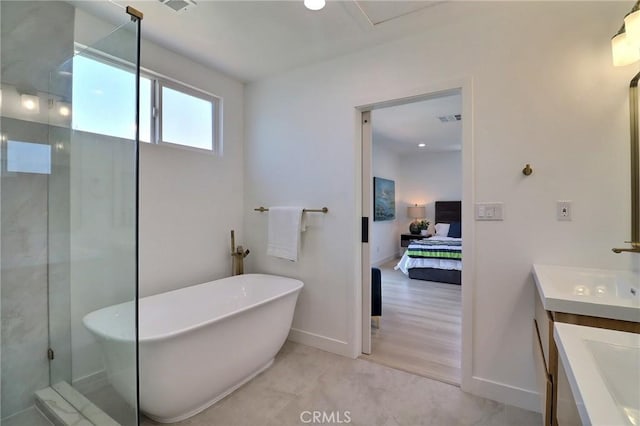 2015 W 42nd Pl, Los Angeles, CA 90062 - ensuite bathroom with vanity, a soaking tub, baseboards, and a shower