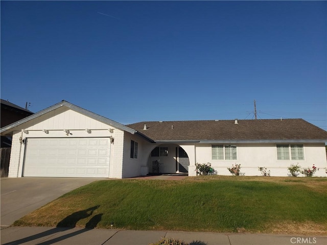 4148 Woodland St, Santa Maria, CA 93455 - ranch-style house with a garage, driveway, a front lawn, brick siding, and roof with shingles