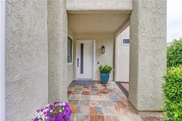 3521 Bahia Blanca W Unit C, Laguna Woods, CA 92637 - view of exterior entry featuring stucco siding and elevator