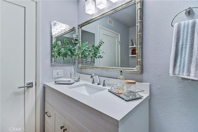 3521 Bahia Blanca W Unit C, Laguna Woods, CA 92637 - bathroom with vanity and a textured wall