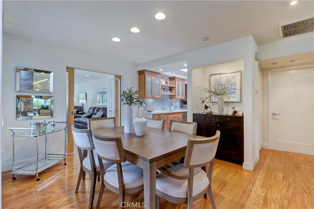 3521 Bahia Blanca W Unit C, Laguna Woods, CA 92637 - dining area featuring light wood finished floors, recessed lighting, and baseboards