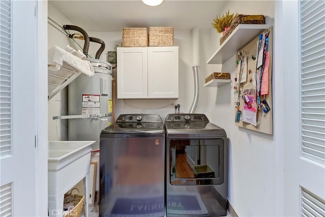 3521 Bahia Blanca W Unit C, Laguna Woods, CA 92637 - laundry area featuring cabinet space, washer and clothes dryer, and electric water heater