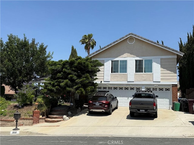 1808 Via Entrada, Rowland Heights, CA 91748 - view of front of property featuring a garage, concrete driveway, and stucco siding
