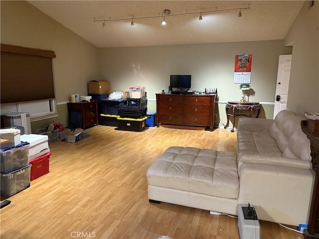 1808 Via Entrada, Rowland Heights, CA 91748 - living area featuring wood finished floors, lofted ceiling, and rail lighting