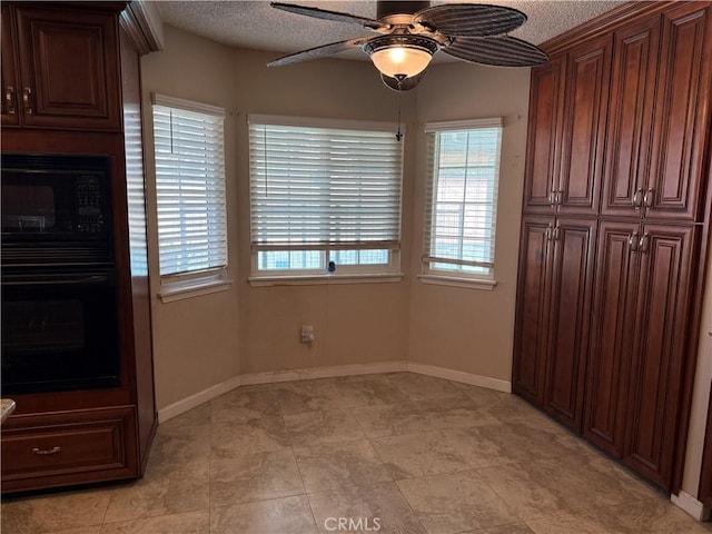 1808 Via Entrada, Rowland Heights, CA 91748 - unfurnished dining area featuring ceiling fan, a textured ceiling, and baseboards