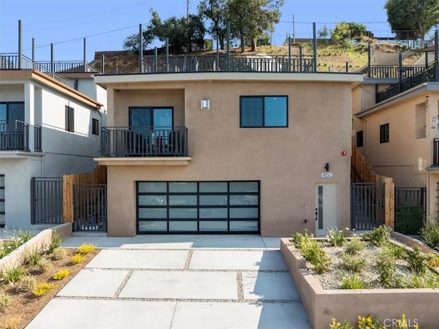 4850 Buchanan, Los Angeles, CA 90042 - view of front facade featuring driveway, stucco siding, and an attached garage