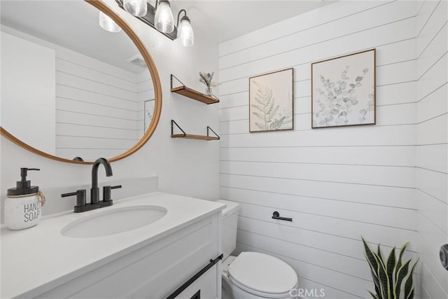 62 Wild Horse Loop Unit 29, Rancho Santa Margarita, CA 92688 - half bathroom with vanity and wooden walls