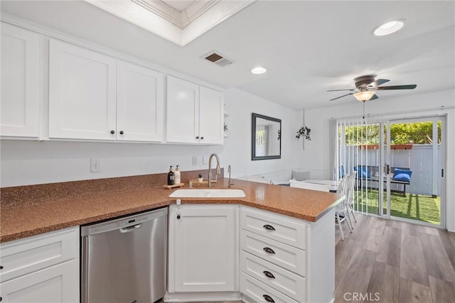 62 Wild Horse Loop Unit 29, Rancho Santa Margarita, CA 92688 - kitchen with dishwasher, a peninsula, a ceiling fan, white cabinets, and recessed lighting