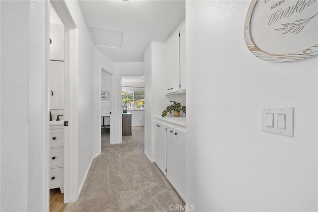 62 Wild Horse Loop Unit 29, Rancho Santa Margarita, CA 92688 - hallway with light carpet and baseboards
