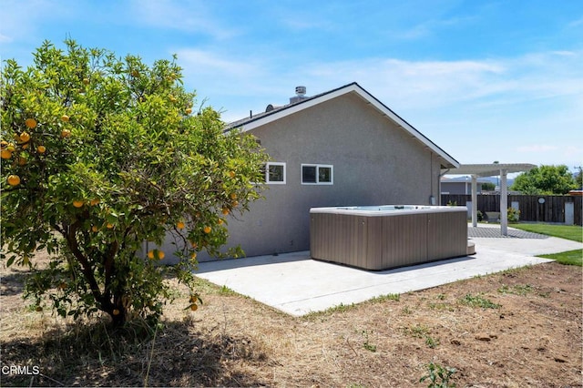 2947 Camino Del Zuro, Thousand Oaks, CA 91360 - rear view of property with a hot tub, a patio area, and stucco siding