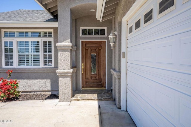 2947 Camino Del Zuro, Thousand Oaks, CA 91360 - doorway to property featuring stucco siding, a garage, and roof with shingles