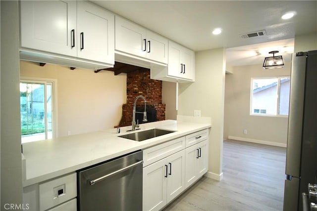 5187 Cedar St, Jurupa Valley, CA 92509 - kitchen featuring stainless steel appliances, recessed lighting, light wood-style floors, light countertops, and white cabinets