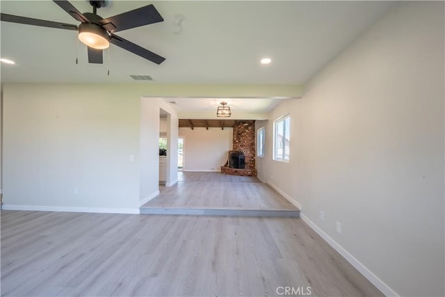 5187 Cedar St, Jurupa Valley, CA 92509 - unfurnished living room featuring light wood-style floors, recessed lighting, a fireplace, and ceiling fan