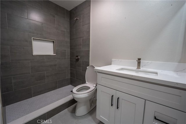5187 Cedar St, Jurupa Valley, CA 92509 - bathroom with vanity, a tile shower, and tile patterned flooring