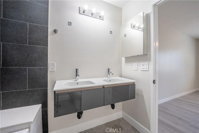5187 Cedar St, Jurupa Valley, CA 92509 - bathroom featuring baseboards and double vanity