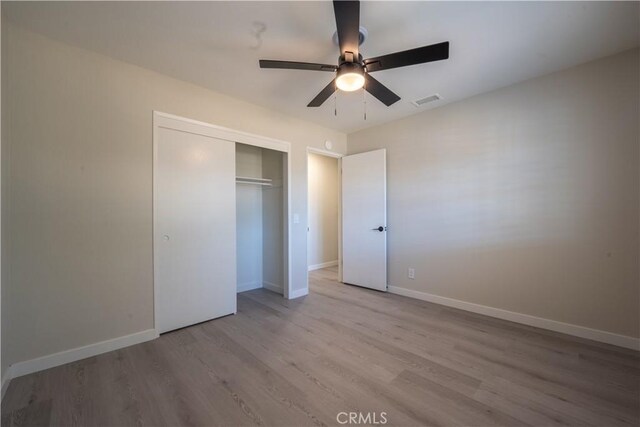 5187 Cedar St, Jurupa Valley, CA 92509 - unfurnished bedroom featuring wood finished floors, a closet, and ceiling fan