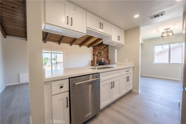 5187 Cedar St, Jurupa Valley, CA 92509 - kitchen with stainless steel dishwasher, light wood finished floors, light countertops, white cabinets, and recessed lighting