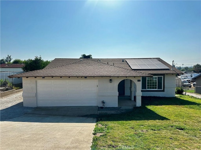 5187 Cedar St, Jurupa Valley, CA 92509 - ranch-style home with roof mounted solar panels, stucco siding, and driveway