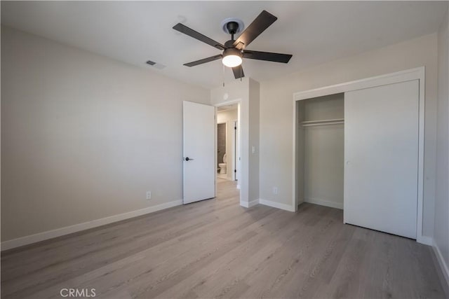 5187 Cedar St, Jurupa Valley, CA 92509 - unfurnished bedroom featuring wood finished floors, a closet, and ceiling fan