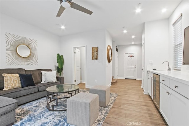 660 Daniel Freeman Cir, Inglewood, CA 90301 - living area featuring light wood-style floors, ceiling fan, recessed lighting, wine cooler, and baseboards