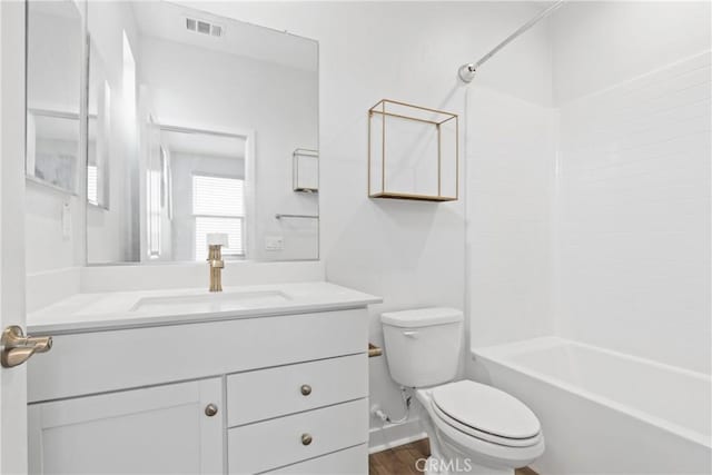 660 Daniel Freeman Cir, Inglewood, CA 90301 - bathroom featuring toilet, vanity,  shower combination, and wood finished floors