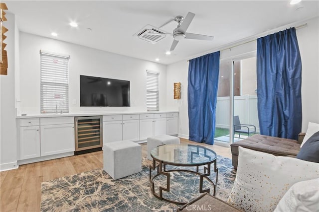 660 Daniel Freeman Cir, Inglewood, CA 90301 - living room with wine cooler, light wood-style floors, ceiling fan, recessed lighting, and bar area
