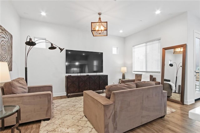 660 Daniel Freeman Cir, Inglewood, CA 90301 - living area featuring a chandelier, wood finished floors, baseboards, and recessed lighting