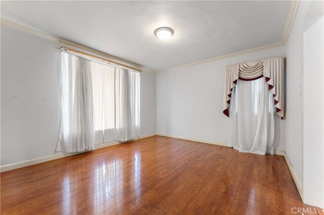 6031 6th Ave, Los Angeles, CA 90043 - unfurnished room with crown molding, wood finished floors, and baseboards