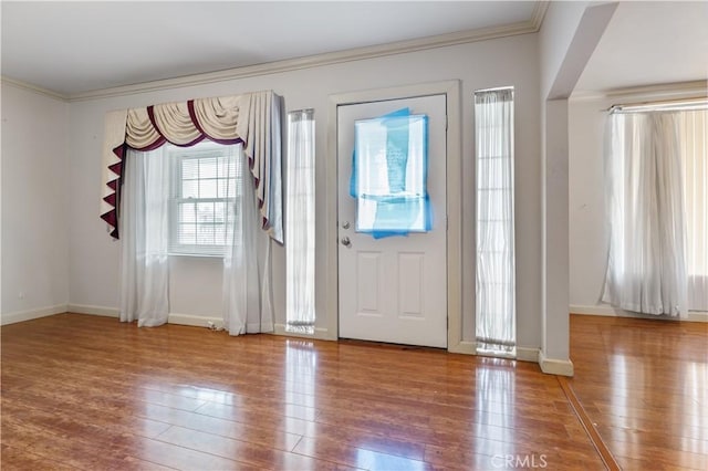 6031 6th Ave, Los Angeles, CA 90043 - entrance foyer with ornamental molding, wood-type flooring, and baseboards