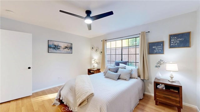 8535 Creekside Pl, Rancho Cucamonga, CA 91730 - bedroom with light wood-style flooring, baseboards, and ceiling fan