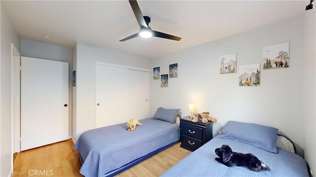 8535 Creekside Pl, Rancho Cucamonga, CA 91730 - bedroom featuring a closet, light wood-type flooring, and a ceiling fan