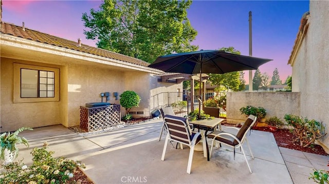 8535 Creekside Pl, Rancho Cucamonga, CA 91730 - patio terrace at dusk with outdoor dining area and a patio area