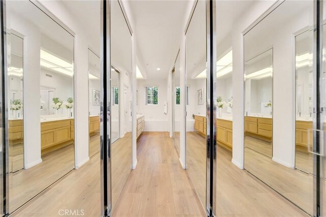 13445 Savanna, Tustin, CA 92782 - hall featuring light wood finished floors and vaulted ceiling