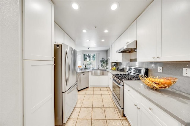 13445 Savanna, Tustin, CA 92782 - kitchen featuring stainless steel appliances, under cabinet range hood, white cabinets, recessed lighting, and a sink