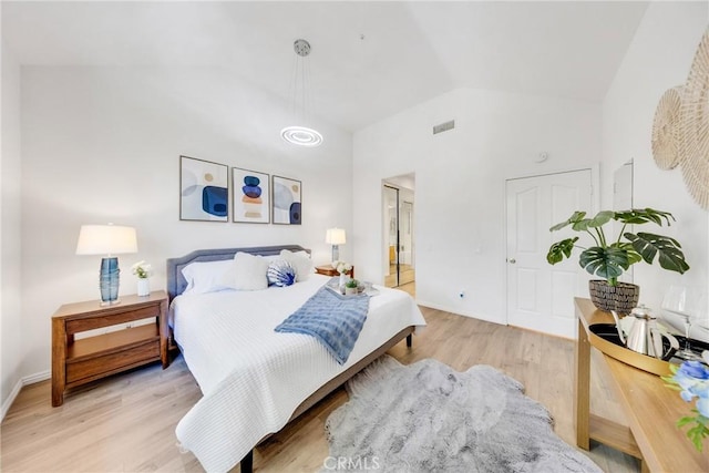 13445 Savanna, Tustin, CA 92782 - bedroom with high vaulted ceiling, light wood finished floors, and baseboards