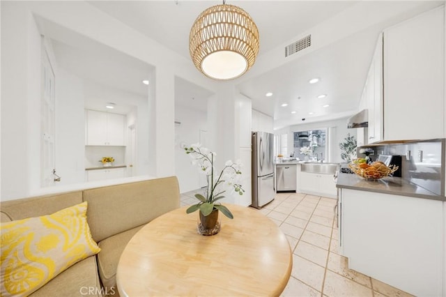 13445 Savanna, Tustin, CA 92782 - dining space with light tile patterned flooring and recessed lighting