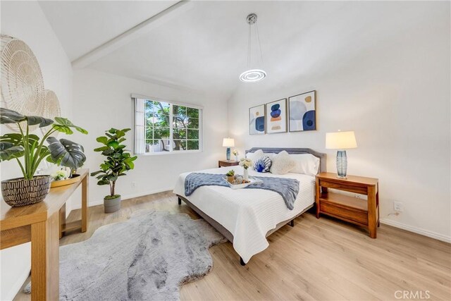 13445 Savanna, Tustin, CA 92782 - bedroom featuring vaulted ceiling, wood finished floors, and baseboards