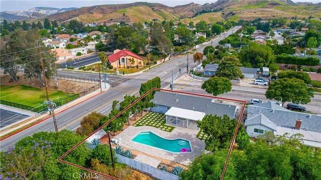 4408 Walnut Ave, Simi Valley, CA 93063 - aerial perspective of suburban area featuring property boundaries highlighted, a mountain backdrop, and a pool