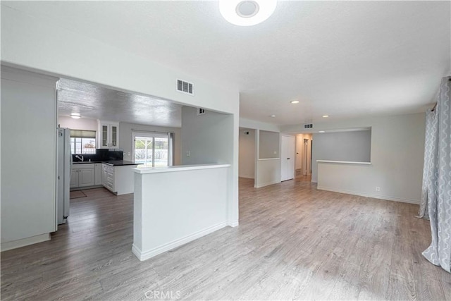 4408 Walnut Ave, Simi Valley, CA 93063 - unfurnished living room featuring light wood finished floors, baseboards, and recessed lighting