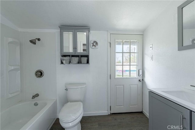 4408 Walnut Ave, Simi Valley, CA 93063 - bathroom with wood finished floors, vanity, toilet, shower / bathtub combination, and baseboards
