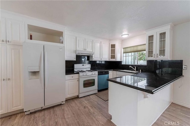 4408 Walnut Ave, Simi Valley, CA 93063 - kitchen with white appliances, a peninsula, white cabinetry, dark countertops, and tasteful backsplash