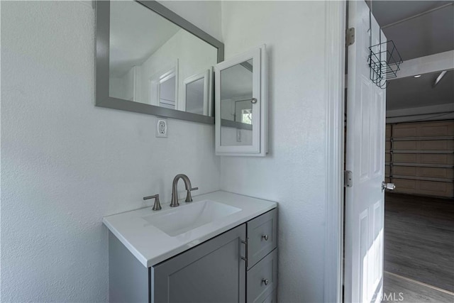 4408 Walnut Ave, Simi Valley, CA 93063 - bathroom with vanity, wood finished floors, and a textured wall