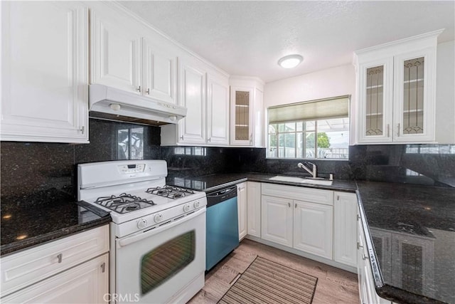 4408 Walnut Ave, Simi Valley, CA 93063 - kitchen featuring gas range gas stove, under cabinet range hood, dishwashing machine, a sink, and white cabinetry