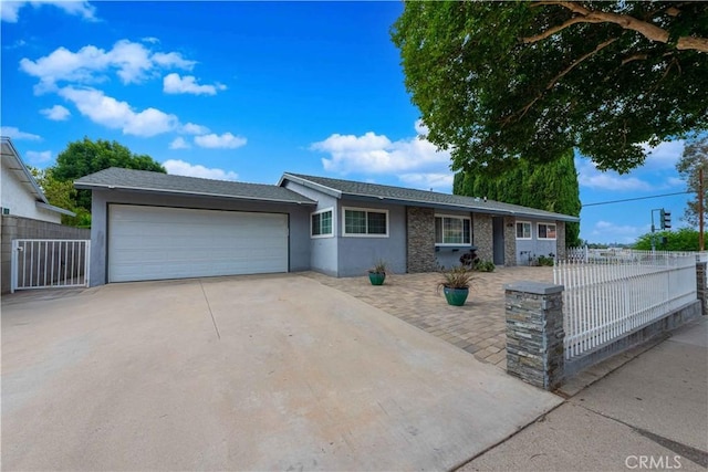 4408 Walnut Ave, Simi Valley, CA 93063 - ranch-style home with concrete driveway, an attached garage, and stucco siding