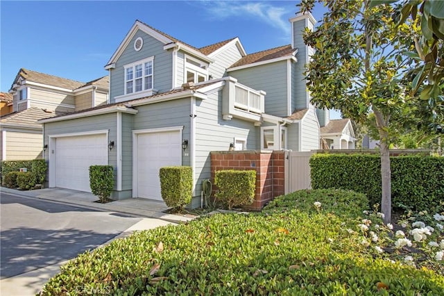 2 Hydrangea St, Ladera Ranch, CA 92694 - view of front of home featuring a garage, a balcony, a chimney, and concrete driveway