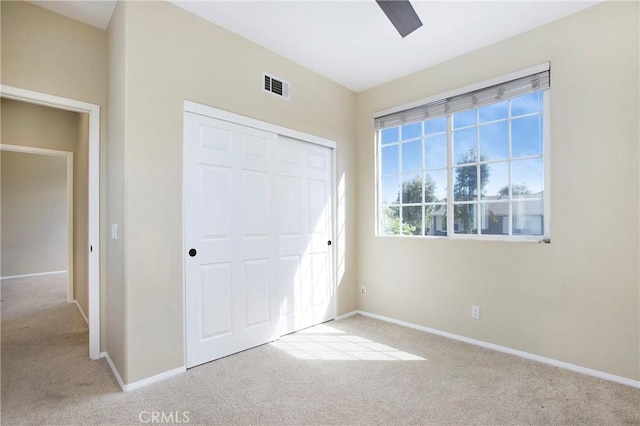 2 Hydrangea St, Ladera Ranch, CA 92694 - unfurnished bedroom with carpet flooring, a closet, baseboards, and a ceiling fan